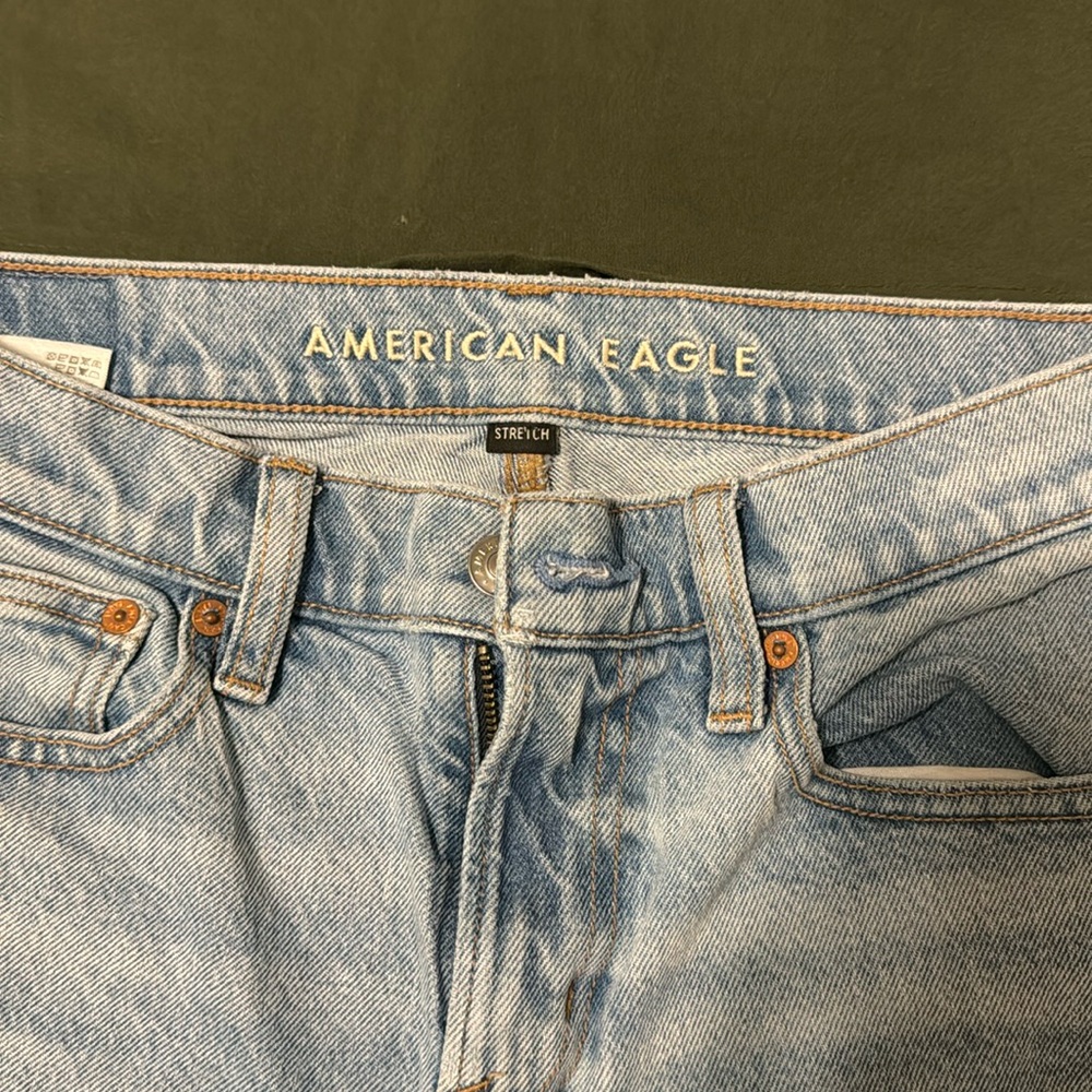 America Eagle, faded jeans ripped him, blown out knee, ripped pocket, sexy!